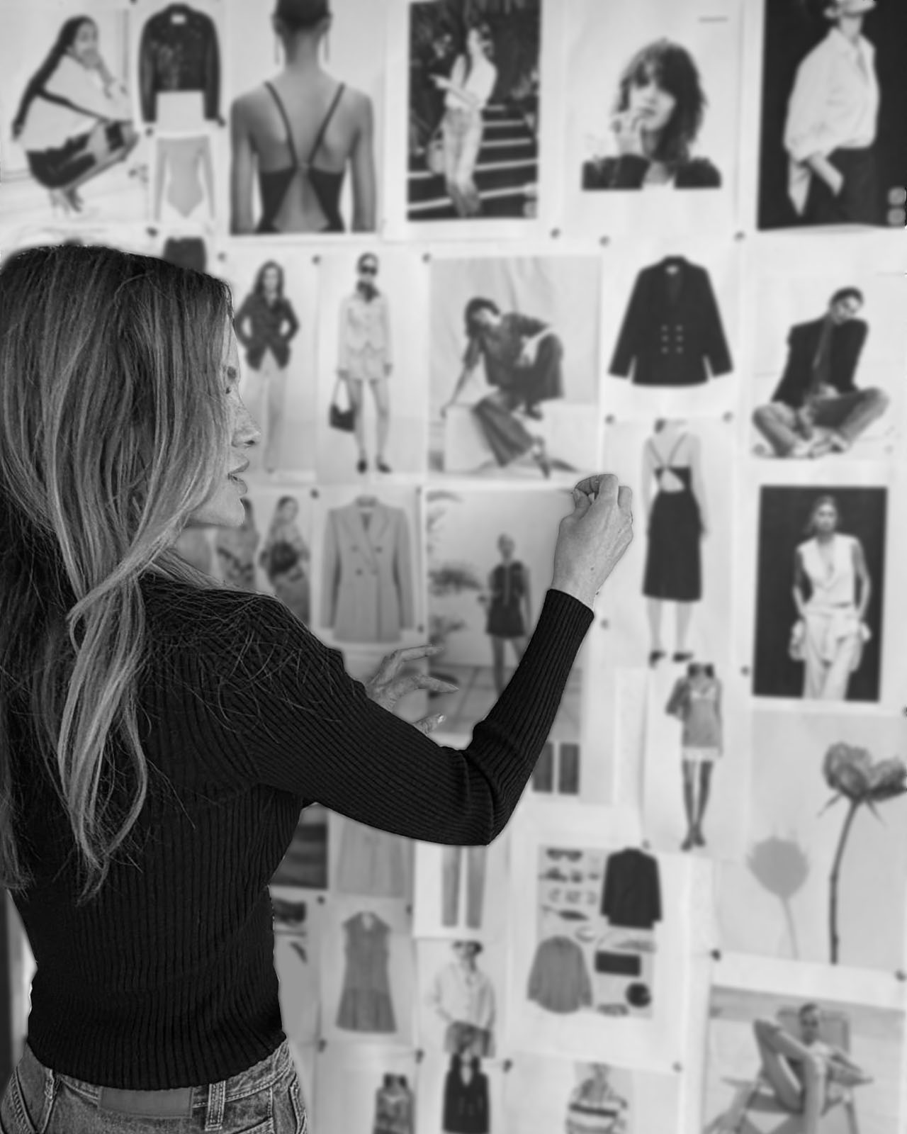 Caroline at her studio mood board, pinning references